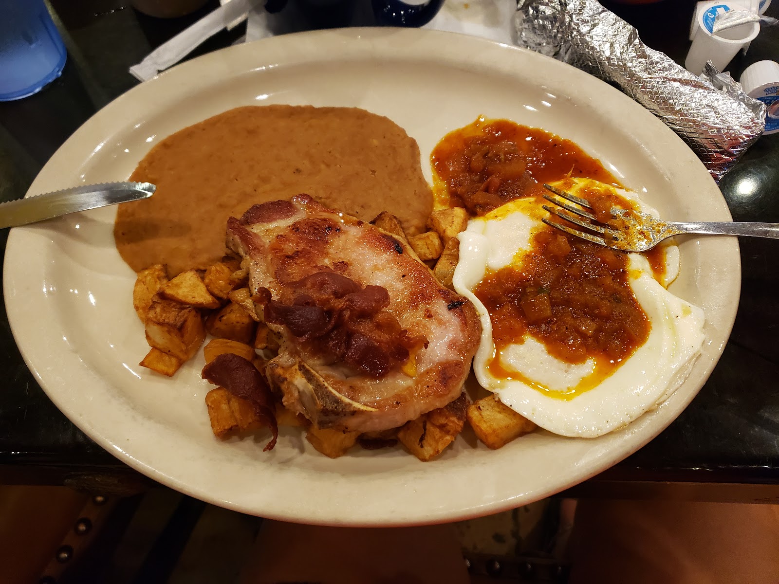 Breakfast plate with pork chop and eggs at El Agave